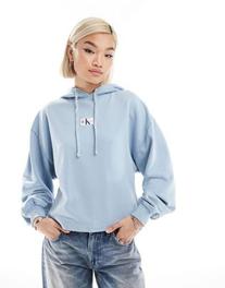 Calvin Klein Jeans washed woven label hoodie in blue offers at R 100 in Asos