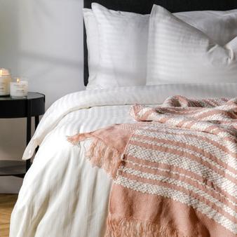 Woollen Blend Throw Pink Snowflake offers at R 299 in Whitehouse