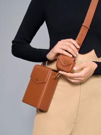 Elongated Crossbody Bag               - cognac offers at R 995 in Charles & Keith